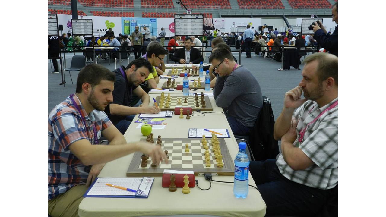[Image of Scott Playing a Grand Master in Round 8 of the 2016 Chess Olympiad]